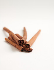 Scattered Cinnamon Sticks on the Floor isolated on white background. Selective focus