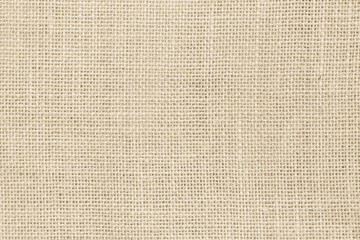 Closeup detail of beige fabric texture background. High resolution photo.