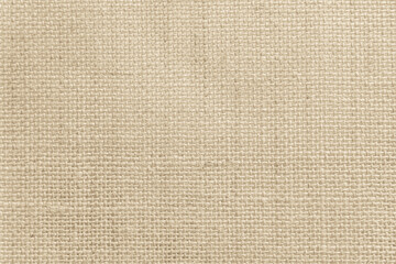 Brown sackcloth woven texture background in natural pattern. Jute hessian burlap, linen background in light beige cream color blank.