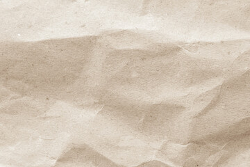 Naklejka premium Crumpled brown paper texture background for design with copy space for text or image.