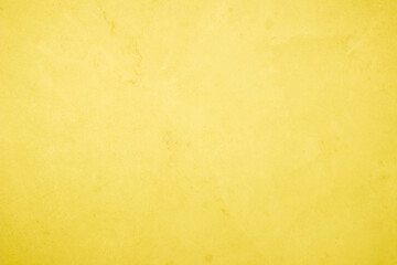 Yellow concrete stone texture for background in summer wallpaper. Cement and sand wall of tone vintage minimal. Concrete abstract wall of light yellow color.
