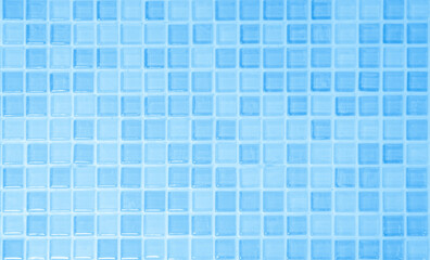 Fototapeta premium Blue light ceramic wall chequered and floor tiles mosaic background in bathroom. Design pattern geometric with grid wallpaper texture decoration pool. Simple seamless abstract surface clean.