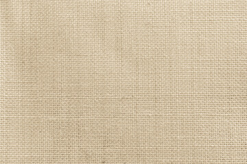 Closeup detail of beige fabric texture background. High resolution photo.