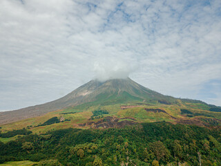 Aerial drone view of Mount Sinabung at Berastagi in North Sumatra, Indonesia.