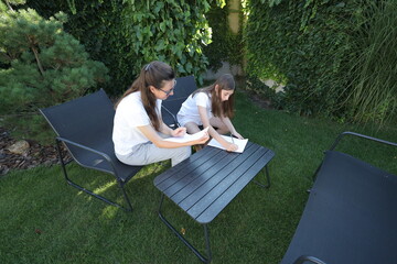 Mother and daughter having fun in the backyard