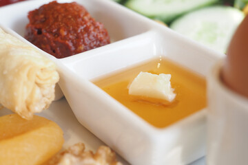 A delightful assortment of colorful dishes featuring various sauces and fresh, quality ingredients