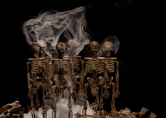 Small homemade plastic skeletons with strange swirling smog effect