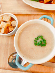 Mushroom soup with bread and fresh mushrooms. top view , autumn seasonal cream soup with vegetables