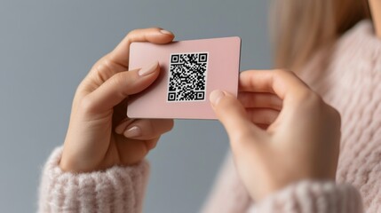 Woman Holding Pink Card with QR Code