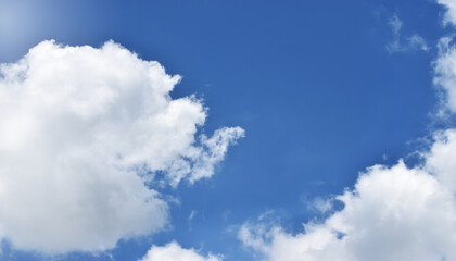 Light blue sky and white clouds. With copy space.
