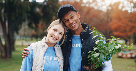 Volunteer, man and woman in park portrait with plant for growth, development or support on earth day. Green, woods and couple in nature for sustainability, community service and social responsibility