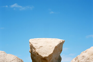 Majestic Rock Formation Under Clear Blue Skies in a Natural Landscape