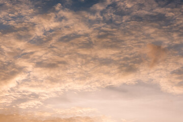 Obraz premium Panoramic view of sunset golden and blue sky nature background. Colorful dramatic sky with cloud at sunset.Sky background.Sky with clouds at sunset.