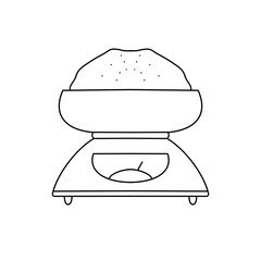 A scale with a bowl on top of it