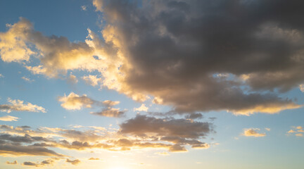 Sunset Clouds background. Dramatic Clouds Sunset Background. Sky with clouds in Sunrise. Sunrise with clouds in various shapes background. Calm Cloud.