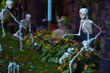 Halloween house outdoor decorations with skeleton, pumpkins and ghosts near the Halloween house...