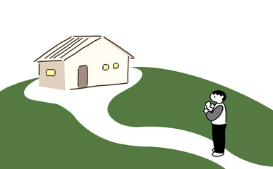 家の前に立っている男性