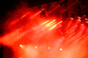 Red-orange color on stage at a concert