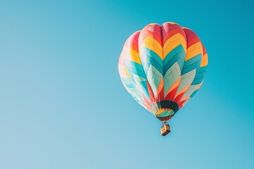 Fototapeta premium A serene aerial scene captures an adventurer soaring in a vibrant hot air balloon beneath a bright azure sky.