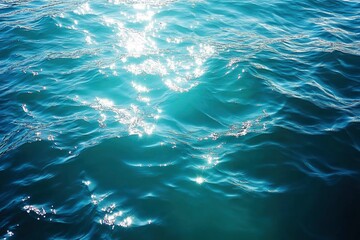 Blue green surface of the ocean in Catalina Island California with gentle ripples on the surface and light refracting , ai