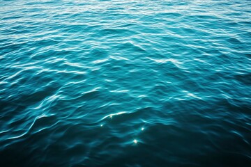 Blue green surface of the ocean in Catalina Island California with gentle ripples on the surface and light refracting , ai