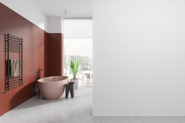 Tiled home bathroom interior with tub, towel rail and window. Mockup wall