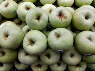 Organic fresh green apples at supermarket. Healthy organic fresh food.
