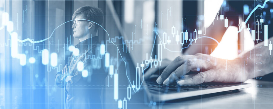 Financial professional analyzing stock market data on digital gr