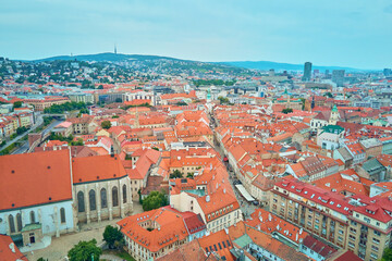 Panorama of Bratislava, Slovakia. Aerial view of historic European city with vibrant red rooftops. Urban landscape with historaical buildings