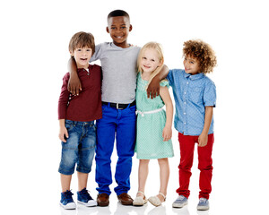 Fototapeta premium Kids, portrait and group of friends in studio with fashion, bonding or diversity on weekend together. Growth, development and happy children with cool style, trendy clothes or fun on white background