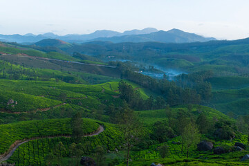 Mountain ranges covered in fog in Munnar which is one of the beautiful and romantic tourist locations in Kerala, India. Clicked on  08-22-2023