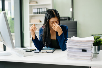 Asian businesswoman is stressed, bored, and overthinking from working