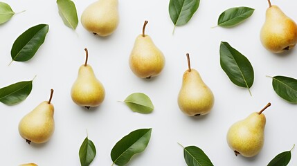 A flat lay of ripe pears and green leaves on a white background, showcasing natural food aesthetics.
