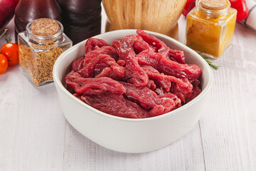 Raw beef meat - sliced strips