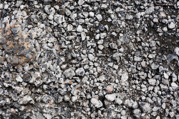 Small gray colour rocks, pebbles and stones as background