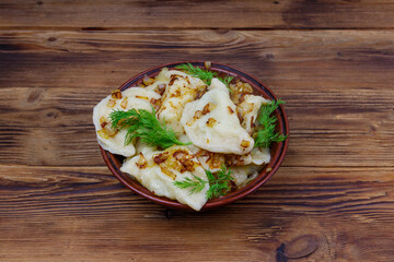 Delicious homemade dumplings on a wooden table