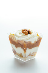 dessert in a clear glass with berries, cream and chocolate