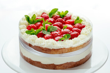 cake with berries, cream and chocolate on a white background