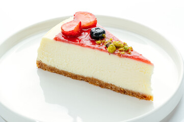 dessert in a clear glass with berries, cream and chocolate