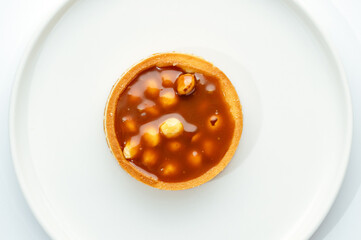 dessert in a clear glass with berries, cream and chocolate