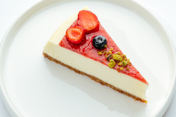 dessert in a clear glass with berries, cream and chocolate