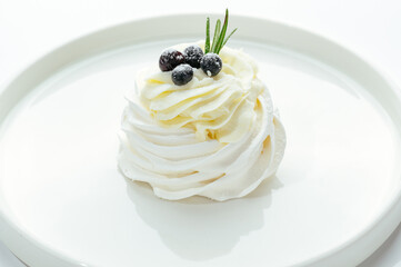 dessert in a clear glass with berries, cream and chocolate
