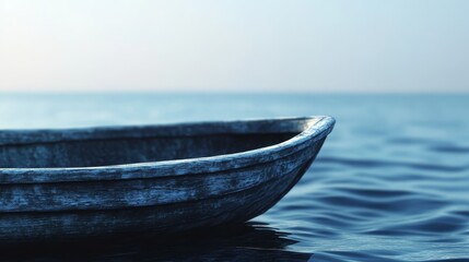 Fototapeta premium A small wooden boat floats serenely on calm blue water, with a vast horizon in the background.