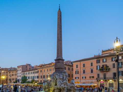 View of Fountain of Four Rivers at Piazza Navona at dusk in Rome, Italy