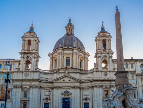 View of Sant'Agnese in Agone and Fountain of Four Rivers at Piazza Navona at sunset in Rome, Italy
