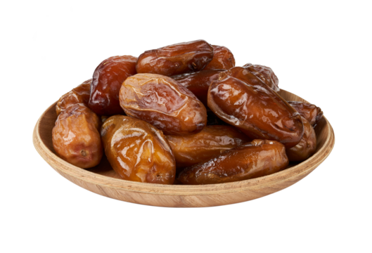 closeup pile of dry date palm fruit isolated on white background in wood bowl