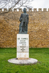 Statue of Gil Eanes next to the wall of the castle of Lagos, Algarve, Portugal