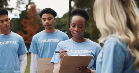 Volunteer, people and discussion with clipboard in nature for community service, planning and leadership. NGO, charity and meeting with checklist in park for donation project, schedule and briefing