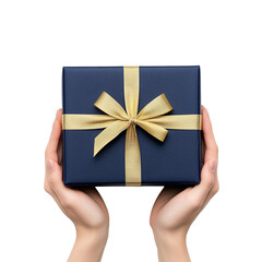 Hands holding a navy blue gift box with gold ribbon top view isolated on transparent background 