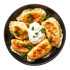 Top view of Polish pierogi with sour cream on a dark plate isolated on transparent background 